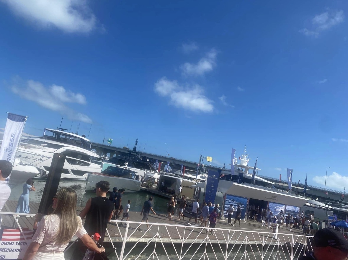 Boats and visitors at a waterfront marina