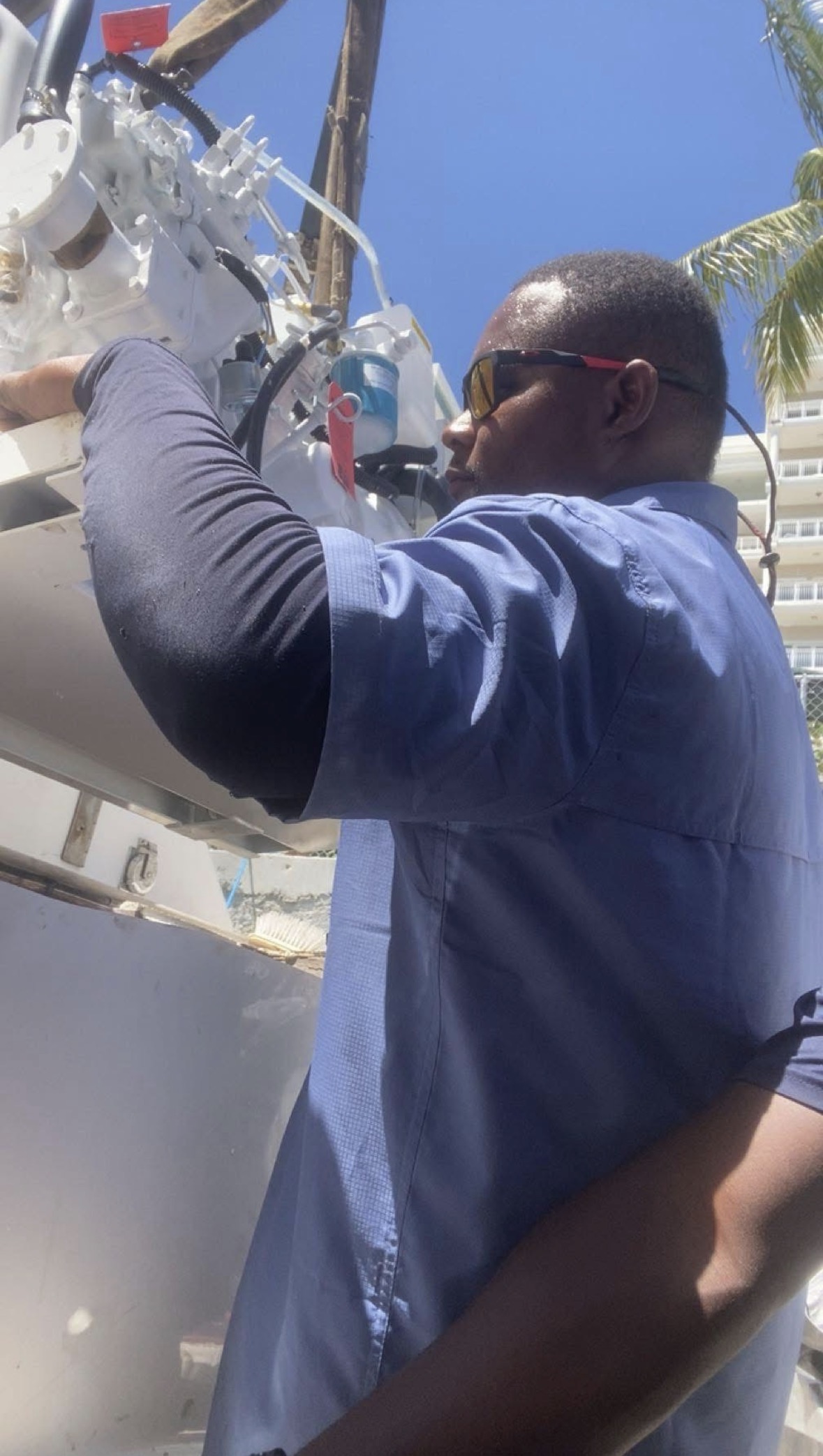 Technician working on equipment outdoors